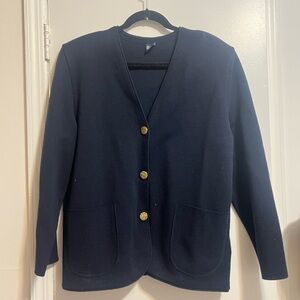 Navy cardigan with front pockets, shoulder pads, and gold rope detail buttons